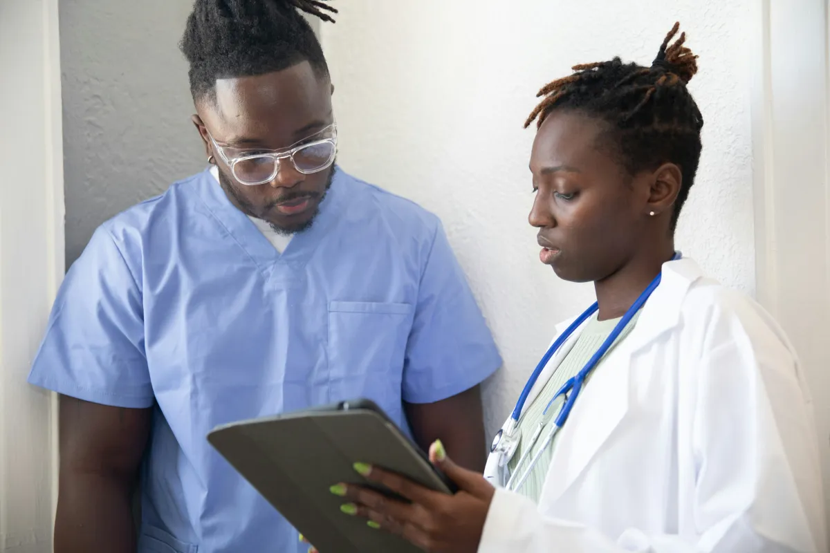 Physician and nurse reviewing a patient chart