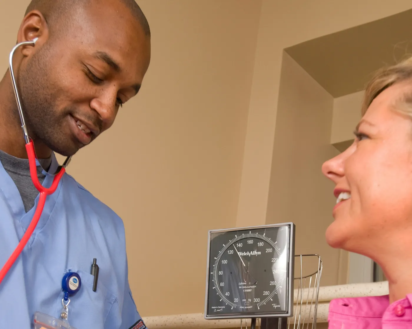 Advanced practice provider checking a patient's blood pressure